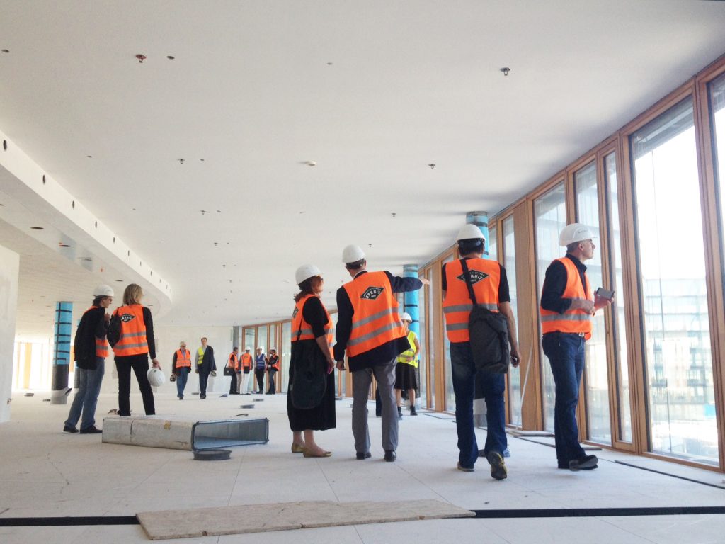 Group of people on a visit to a building site