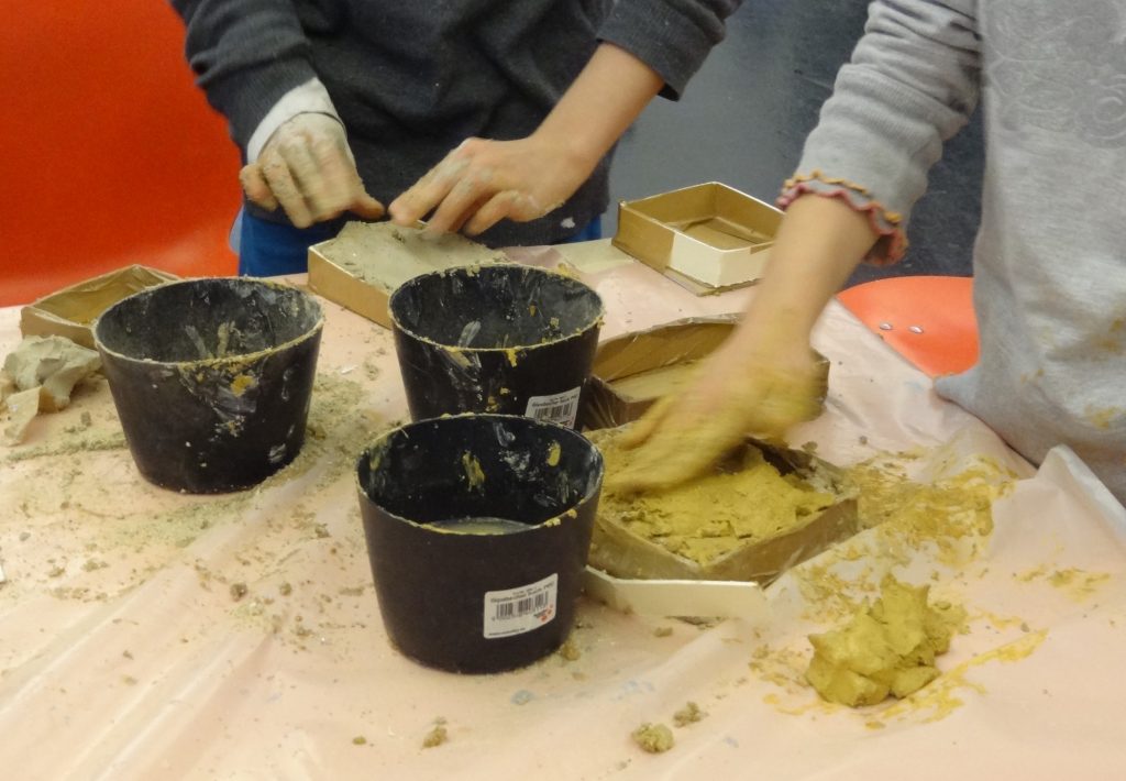 Two children working with clay