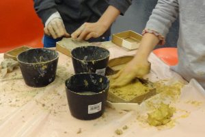 Two children working with clay