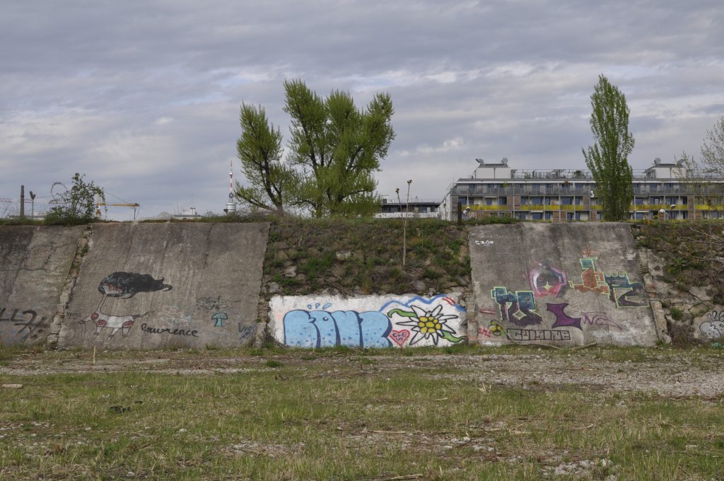 Old wall with graffiti in the wasteland on the Nordbahnhof site