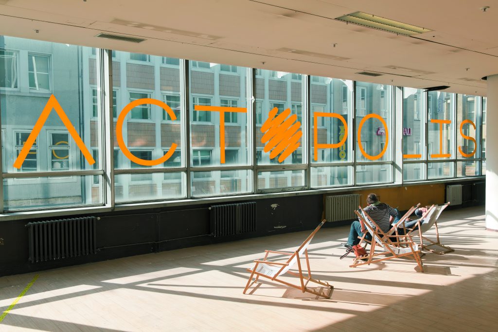 People sitting in deckchairs in a room