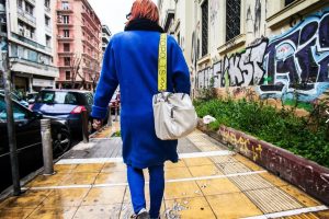 woman from behind with blue coat