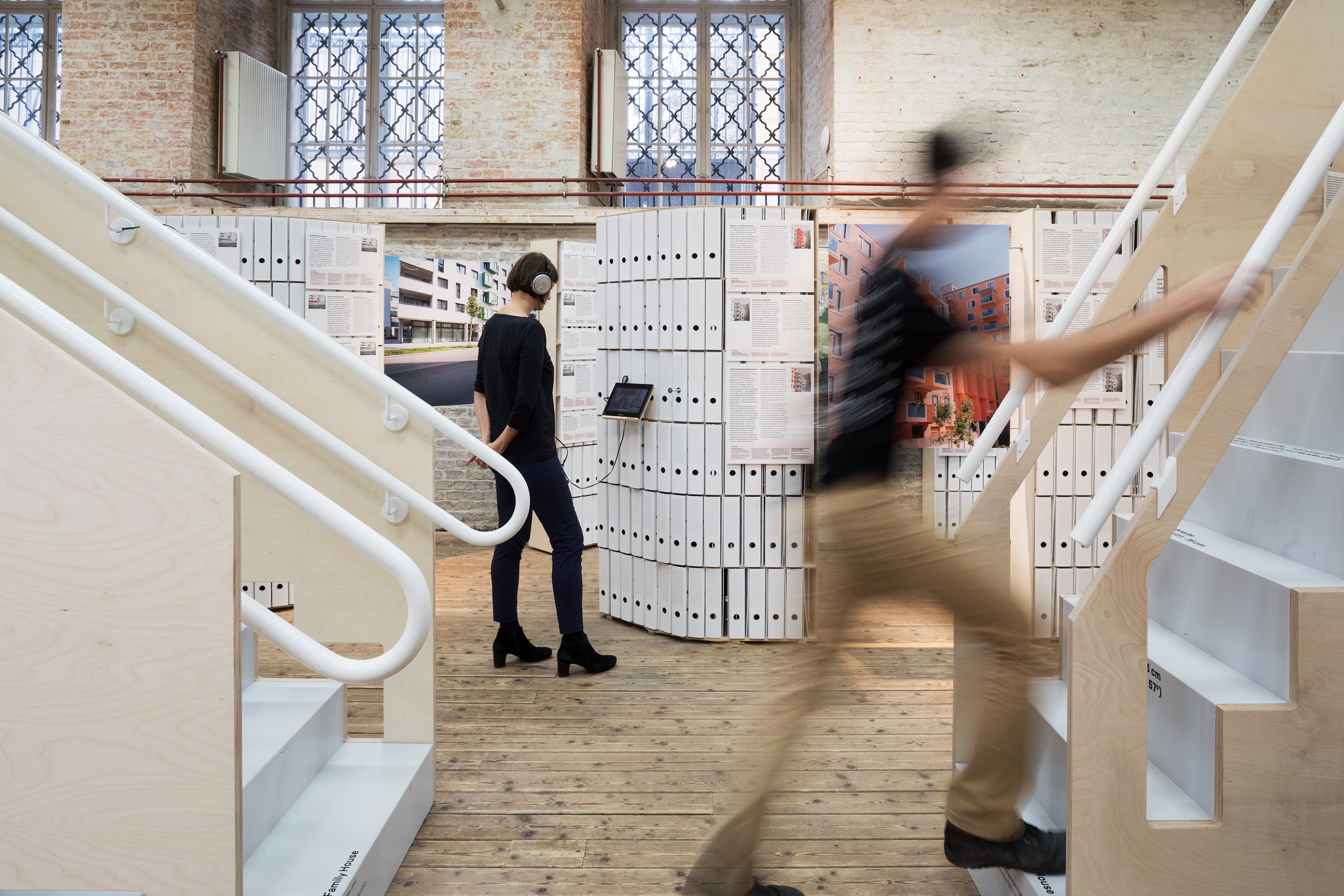 Man going up stairs and woman behind