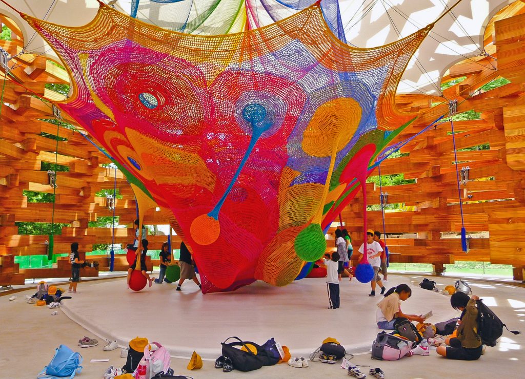 A colourful net stretched in a room