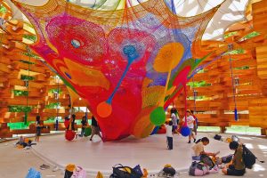 A colourful net stretched in a room