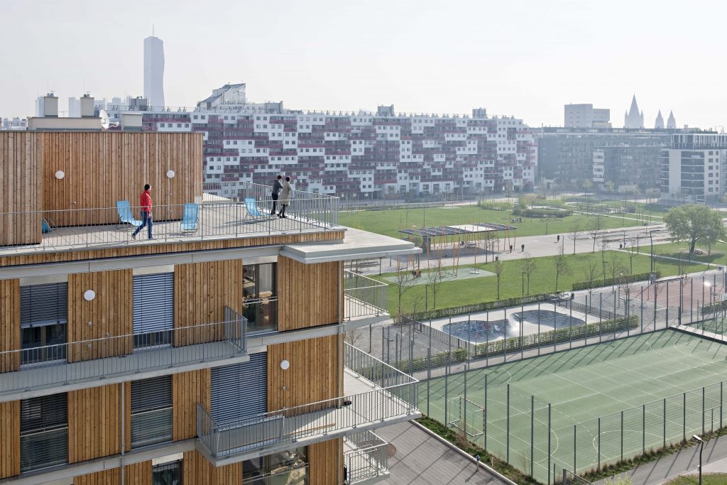 Apartment building with a park in the background