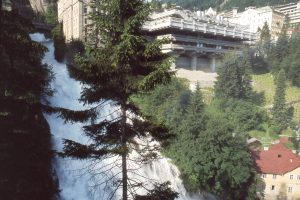 concrete architecture next to a waterfall