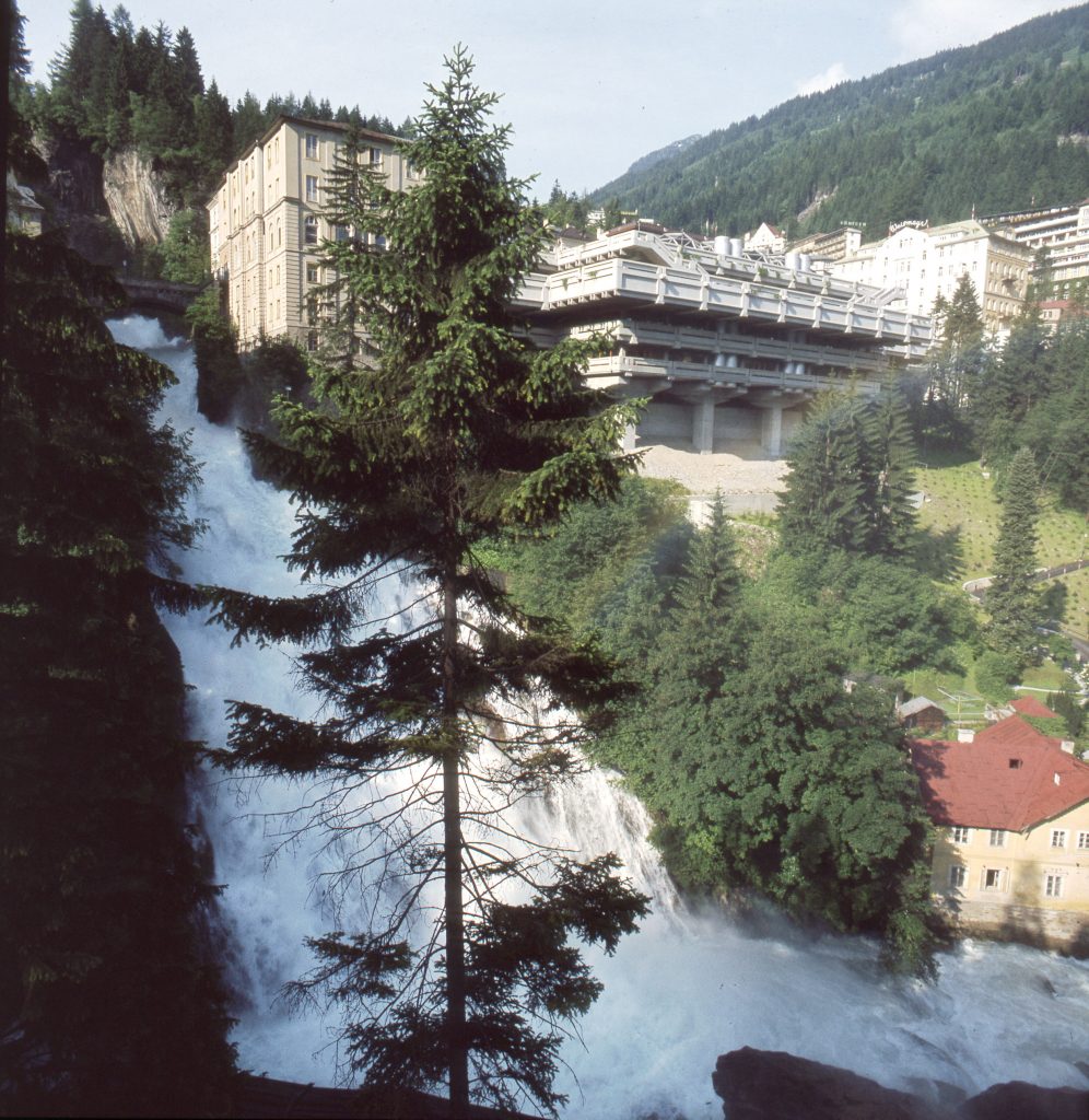 concrete architecture next to a waterfall