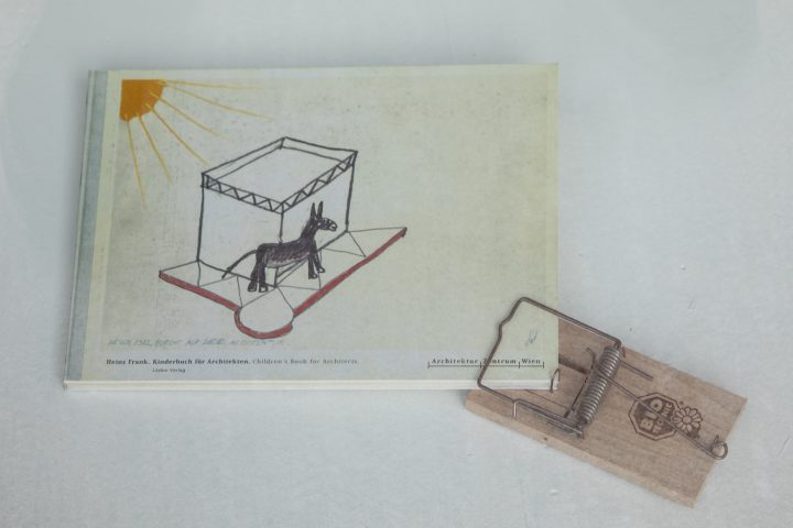 White book with mousetrap