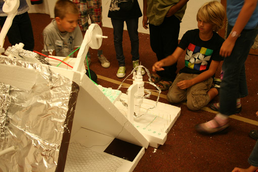 The Az W Space Station: a flying construction site in outer space