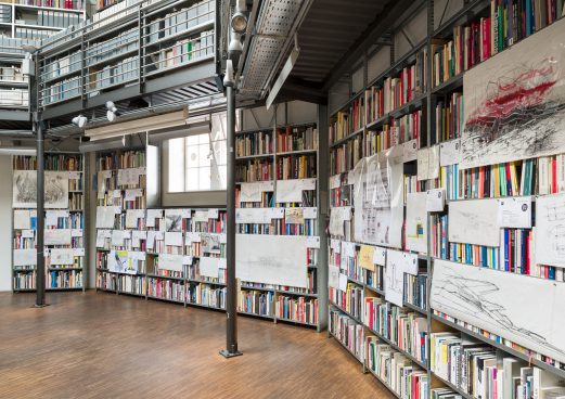 shelves filled with books and attached sketches