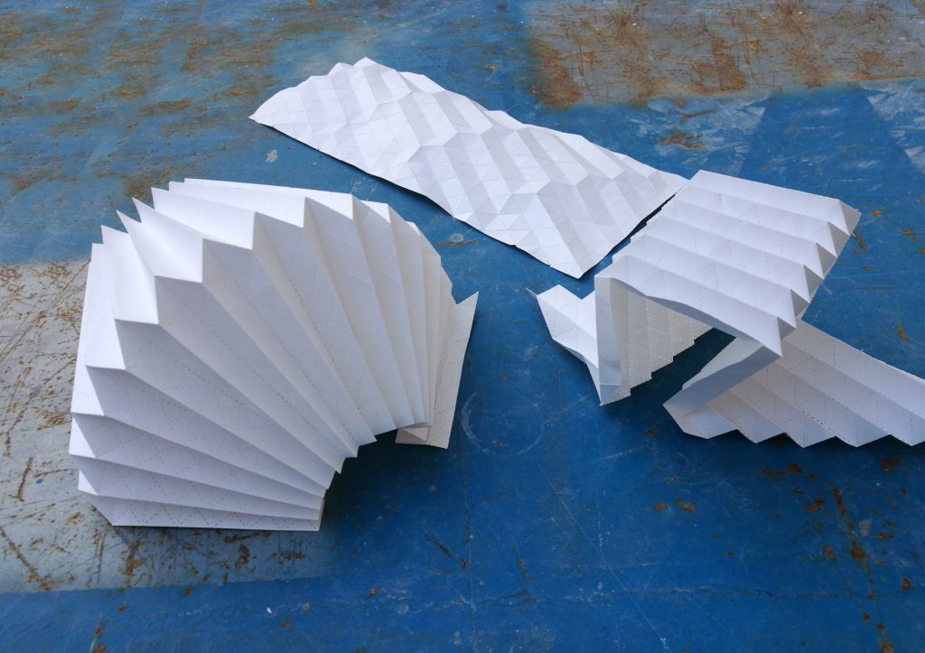 artfully folded white paper sheets