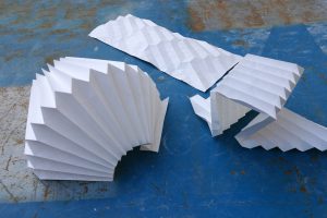 artfully folded white paper sheets