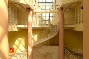 A curved staircase with two columns