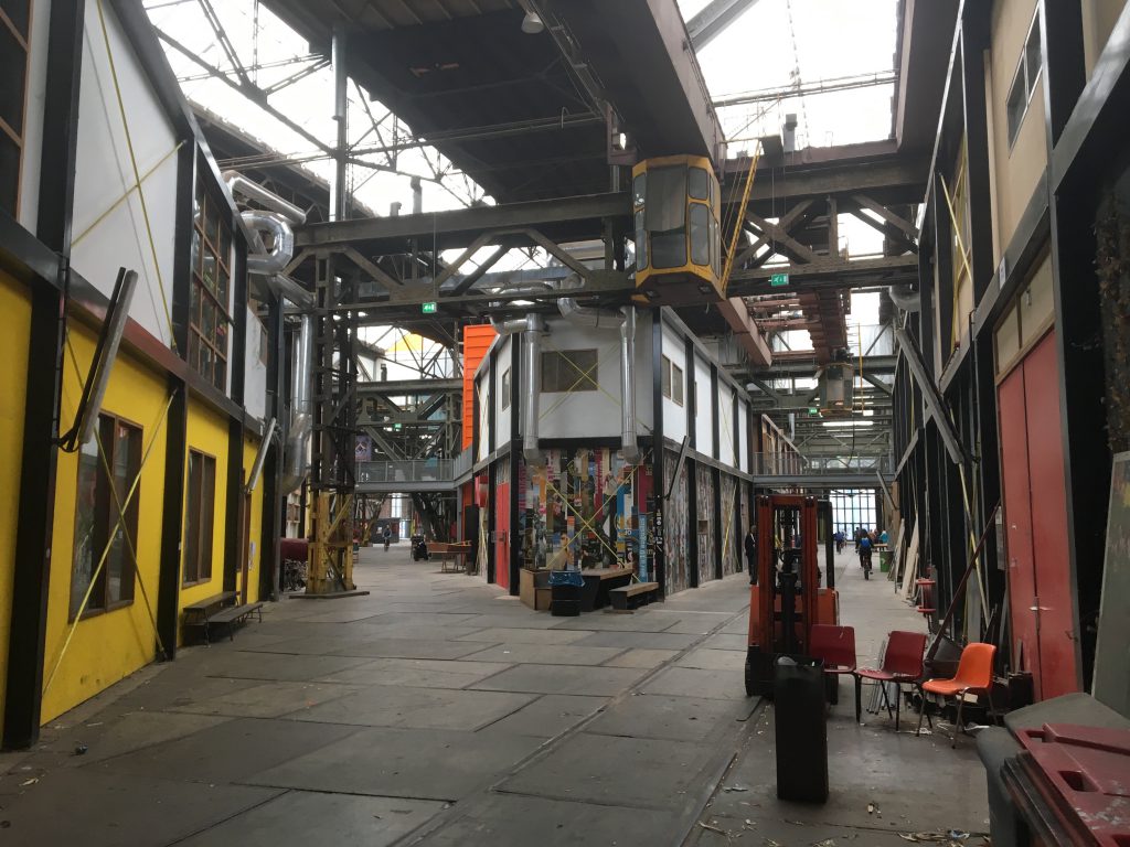Interior view of a factory building with scaffolding