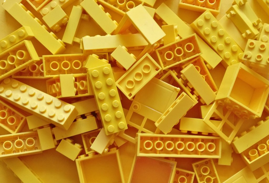 many yellow Lego bricks disordered on top of each other