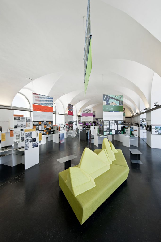 A green couch in an exhibition hall