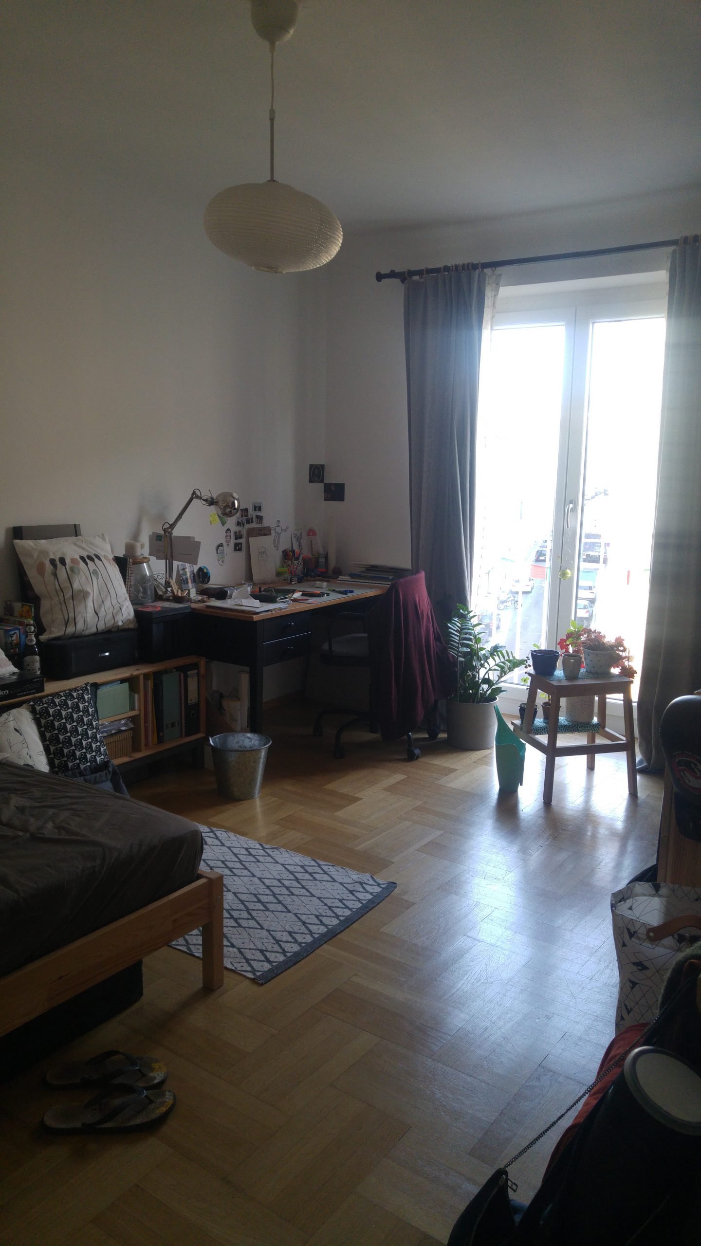 living room with beige lampshade and window