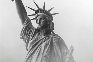 Black and white photo of the Statue of Liberty in the fog