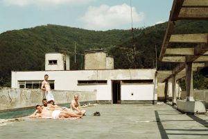 Five people on a terrace