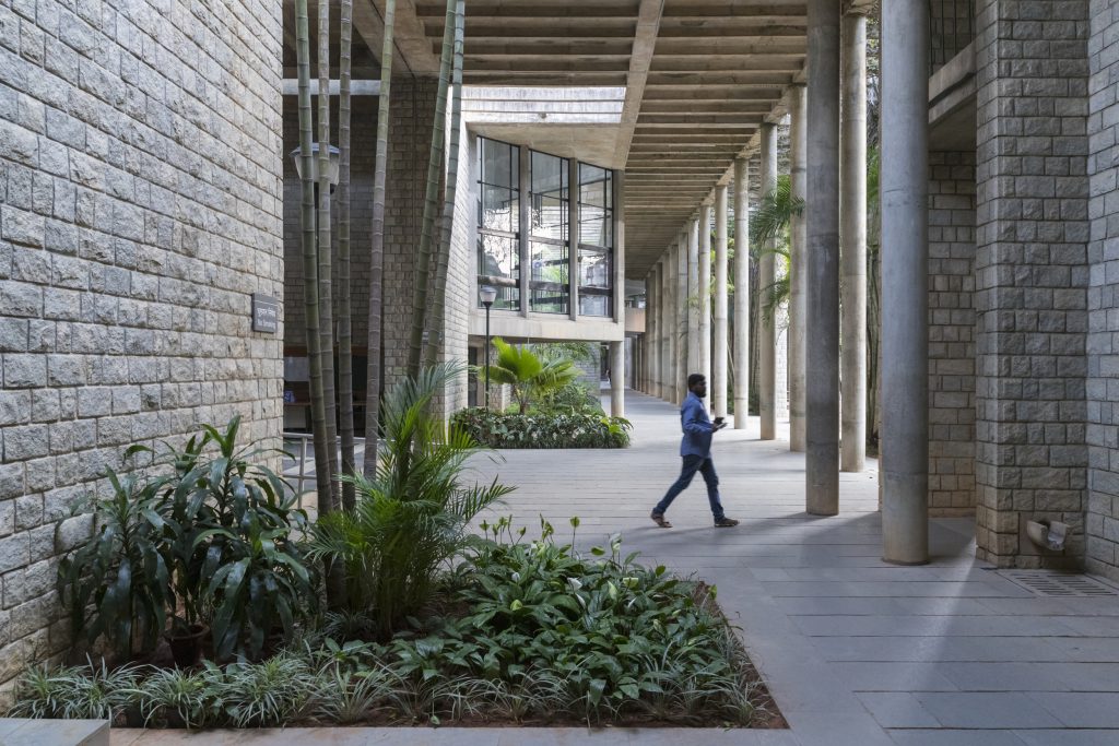 Man in corridor with columns