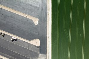 green fields and parking zone from bird's eye view