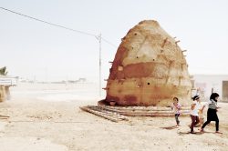 children in desert surroundings with hill