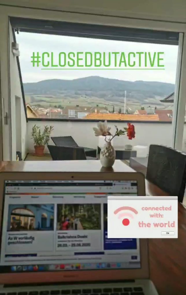 Laptop on table with view on balcony