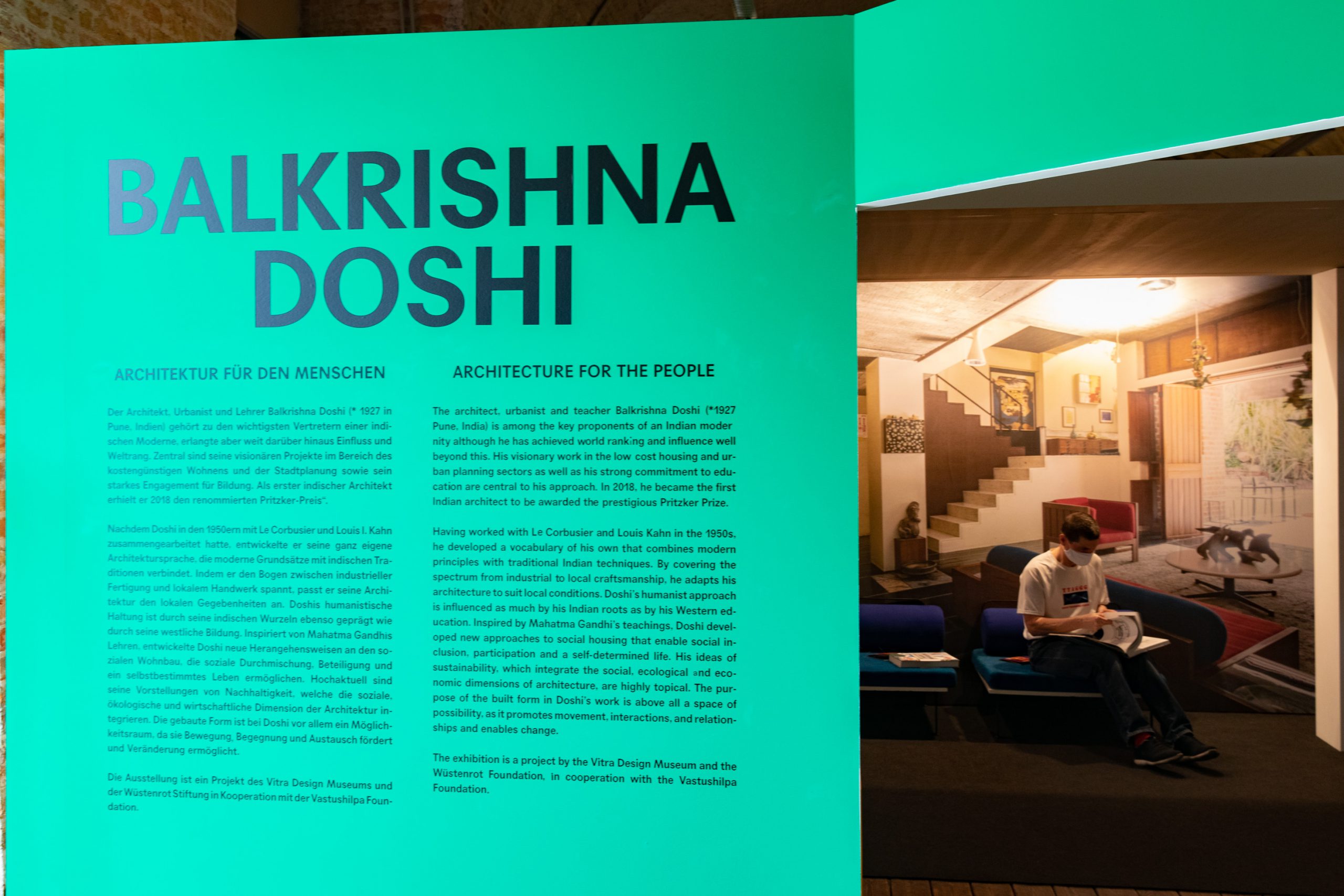 green wall with a text about Balkrishna Doshi