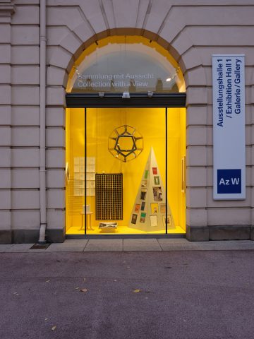 Shop window with yellow background and pyramid