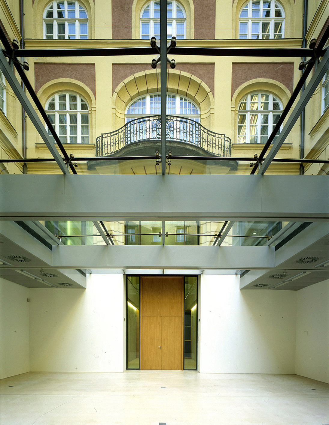 View below the glass roof to the courtyard façade