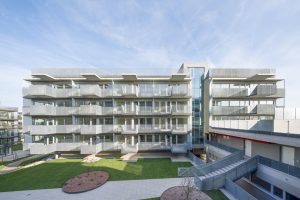 Multi-storey residential block with courtyard in the sunlight