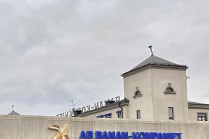Building with banana and blue lettering in front of it