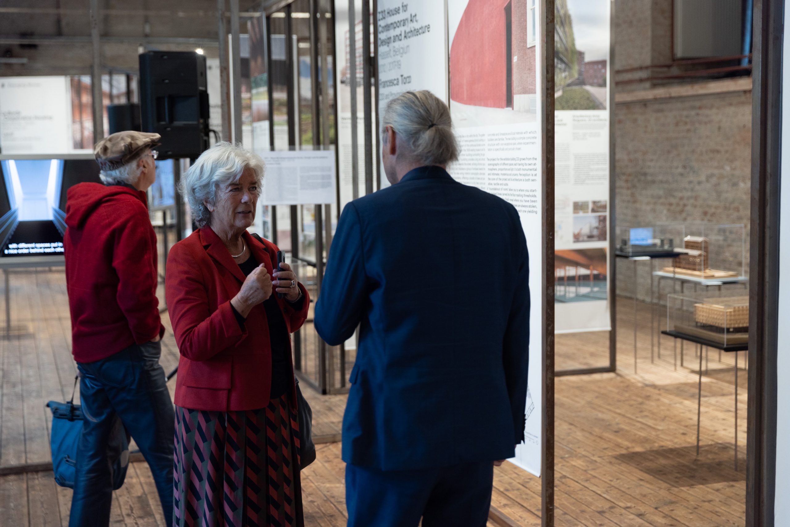 3 persons in an exhibition
