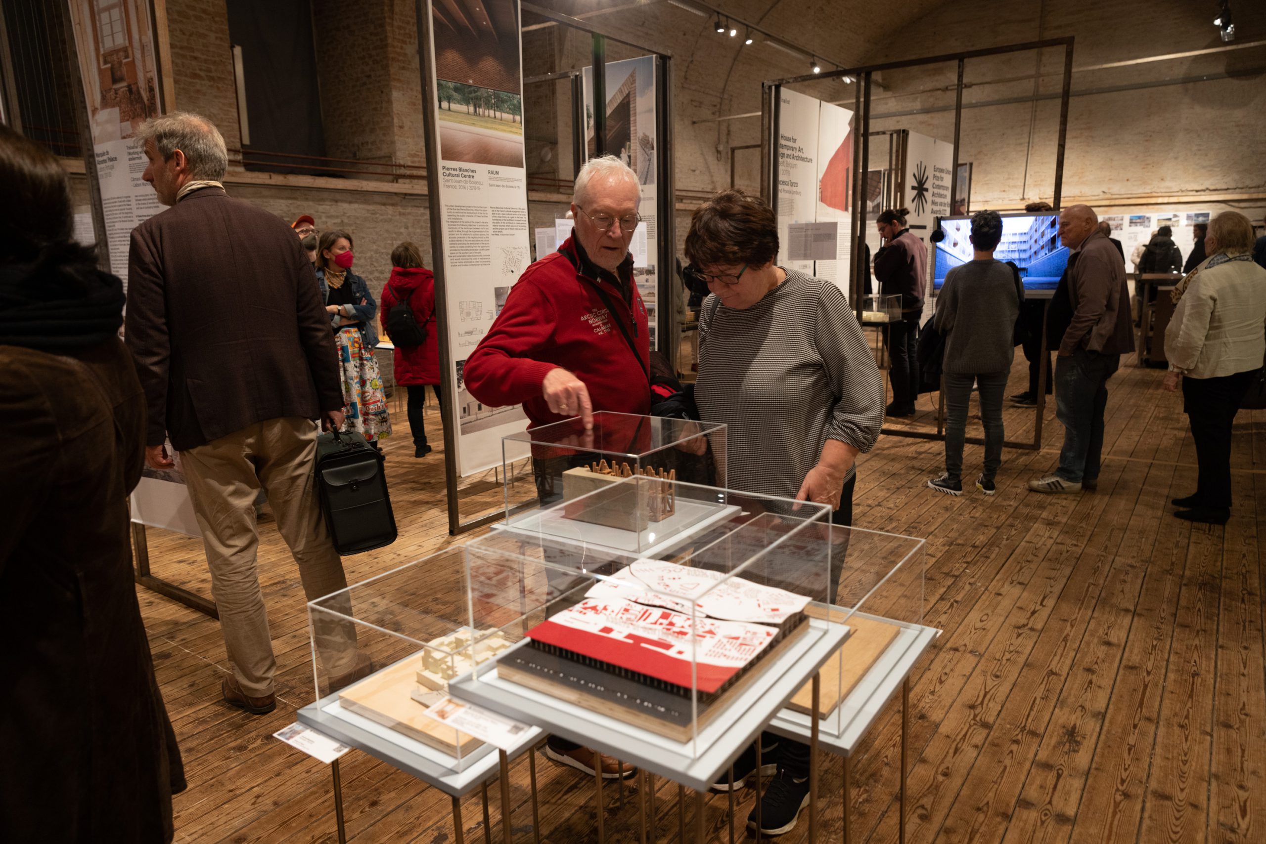 many people in an exhibition space