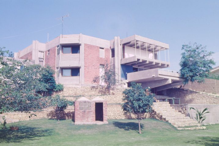 Residential house with large stone staircase into a garden