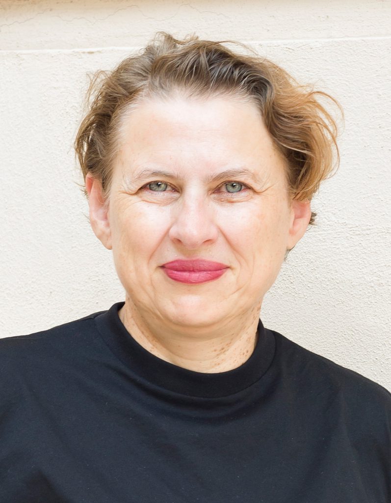 Woman with short hair and black shirt