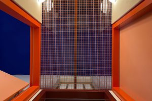 Interior with red grid and blue background
