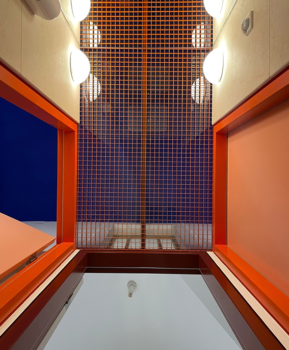 Interior with red grid and blue background