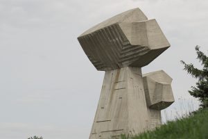 Large concrete sculpture in a meadow