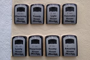 8 small signs on a wall, with different inscriptions