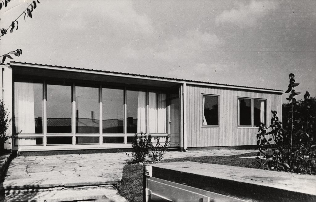 black and white photo with bungalow with glass front
